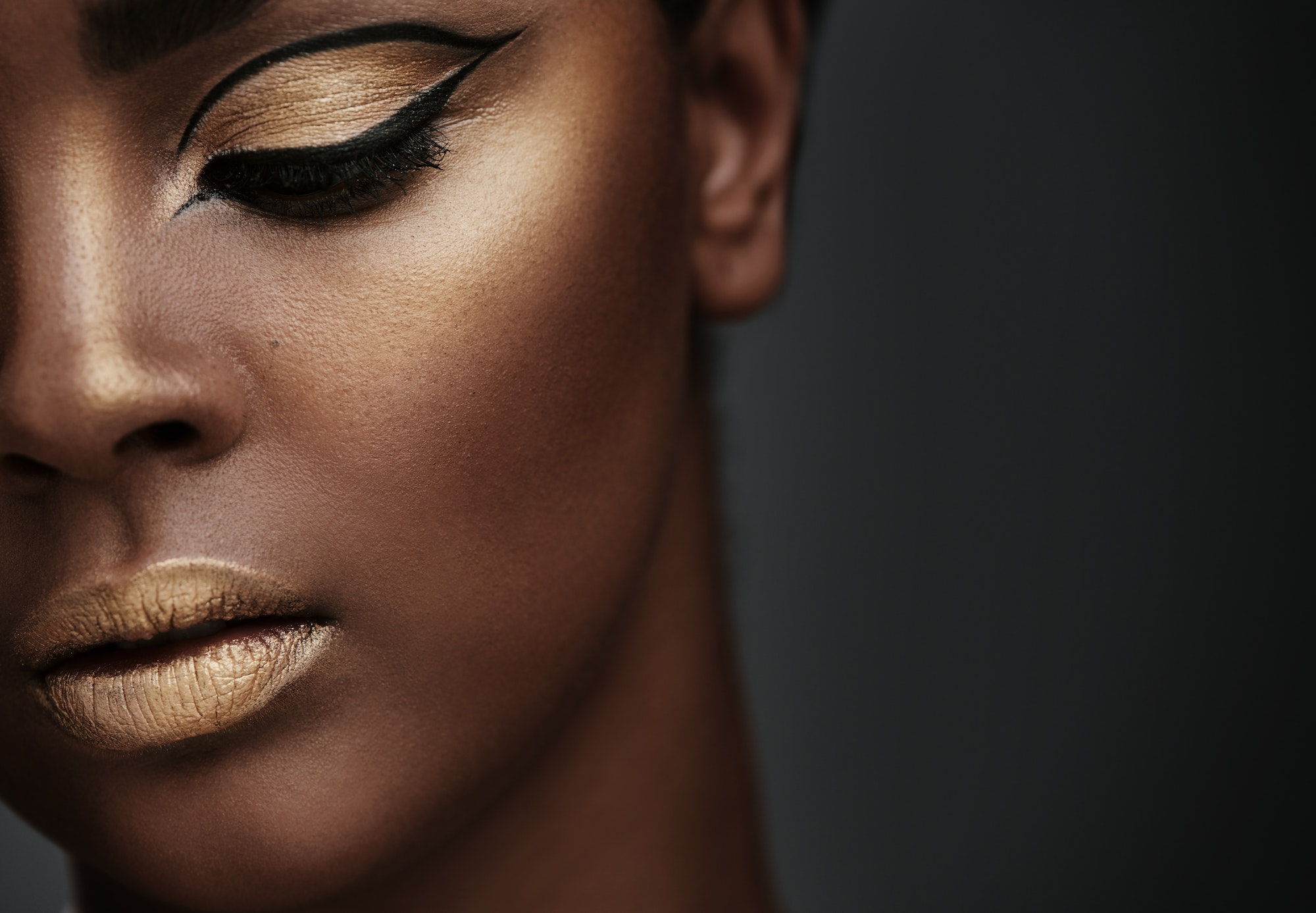 Gold is a state of mind. Cropped shot of a beautiful young woman wearing makeup.